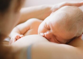 Mother breastfeeding child